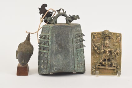 Lot of 3 bronzes. To include: a 19th century plaque of Shiva, an early Thai buddha's head, and a