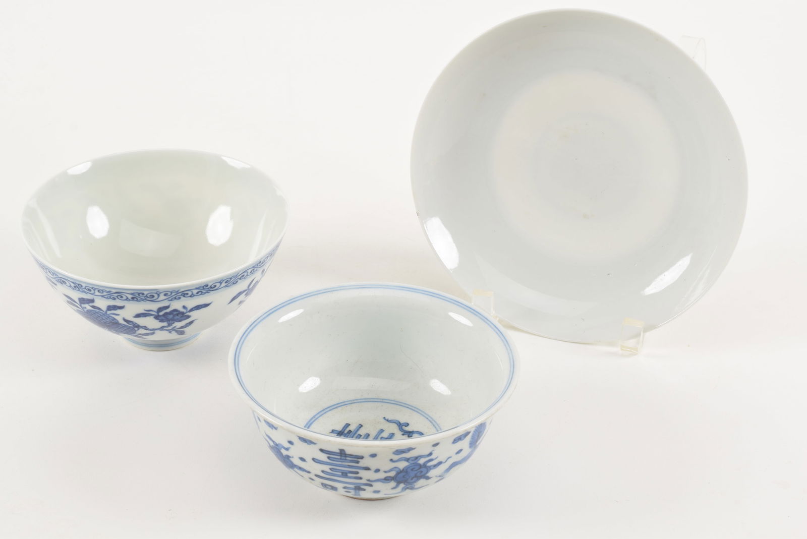 3 porcelains. China. 20th century. To include: a white plate and 2 underglaze blue bowls (one with (1 of 9)