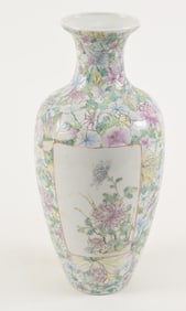 Porcelain vase. China. Early 20th century. Millefleur ground with floral panels. Chien Lung mark.