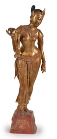 Bronze apsara. Thailand. 20th century. standing figure. Gilt surface. 36in high.