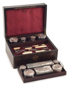 Gentleman's brass bound rosewood and fitted traveling dressing kit. With silver covered jars and