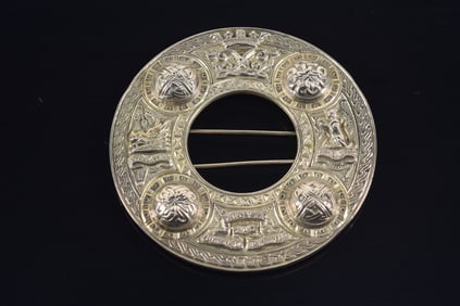 Early 20th century Scottish silver large kilt pin. Raised rondel knots and relief decoration of