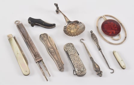 Lot of antique silver pocket knives and accessories. To include: 1) Lady's shoe form advertising