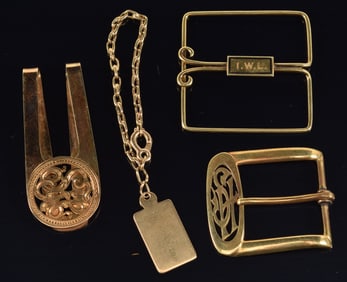 Lot of gold accessories. To include: 1) 14K Tiffany & Co. child's bracelet with charm dated