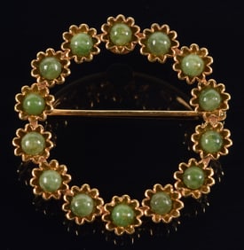 14K gold wreath form pin set with polished spherical green stones. Marked A & Z 14K on reverse.