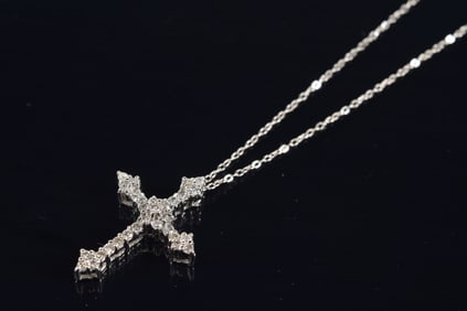 14K white gold diamond cross pendant necklace. Cross encrusted with small round cut diamonds. Marked