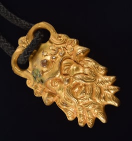 Arthus Bertrand French gilt bronze pendant of a classical figure with forked beard. Stamped