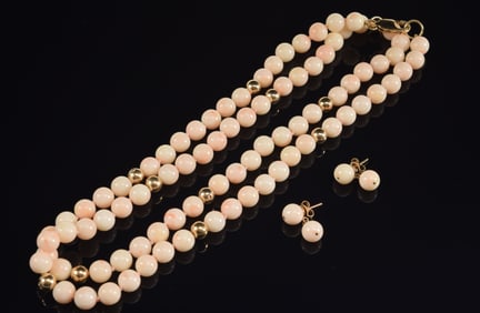 14K gold angel skin coral beaded necklace and earring set. Clasp marked. Necklace length: 31in. 73.1