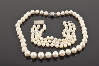 2 pieces of pearl jewelry. 1) Pearl necklace. 17.25in length. Pearls approx. 0.5in diameter. 2) 3