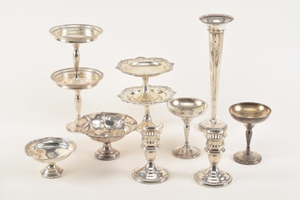 Lot of 11 weighted sterling silver items. Largest: 12in high. Some with minor dents and bends.