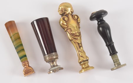 Lot of 4 antique seals, including gilt figural, agate handled, etc. Largest: 3.75in length.