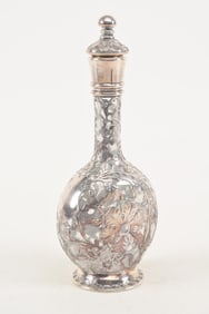 American sterling silver overlay glass decanter. Floral scrollwork decoration. Monogrammed.