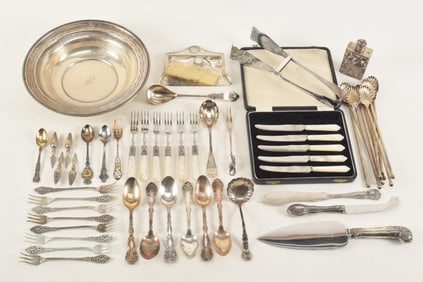 Collection of silver tableware including sterling and coin. To include oyster forks, tea spoons,