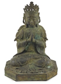 Chinese bronze seated Kuan Yin figure with praying hands. Green patina. 14.5in high.