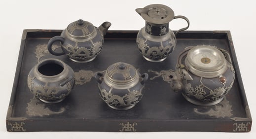 Yi Hsing tea set. China. Early 20th century. Pewter mounted pottery with a pewter mounted