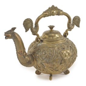 Bronze ewer. Sri Lanka. 19th century. Finely cast with buddhist divinities and foliate scrolling.