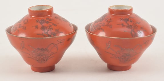 Pair of porcelain covered cups. Orange glaze with gilt floral decoration. 3.5in diameter.