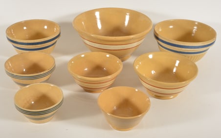 8 Assorted yellowware bowls with band decoration, early 20th Century. Largest diameter