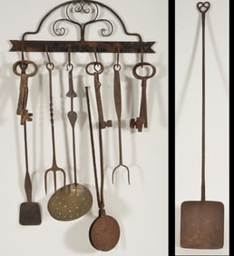 19th Century Iron peal with heart shaped handle together with an early iron implement rack with