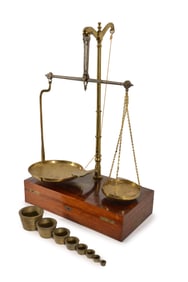 English mahogany cased portable scale with brass weights. The top with engraved name boss reading