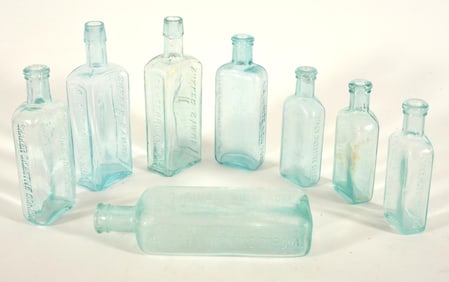 8 Shaker aqua medicine bottles, including two No. 1 Shaker Syrup, Canterbury N.H. 8 in, and six
