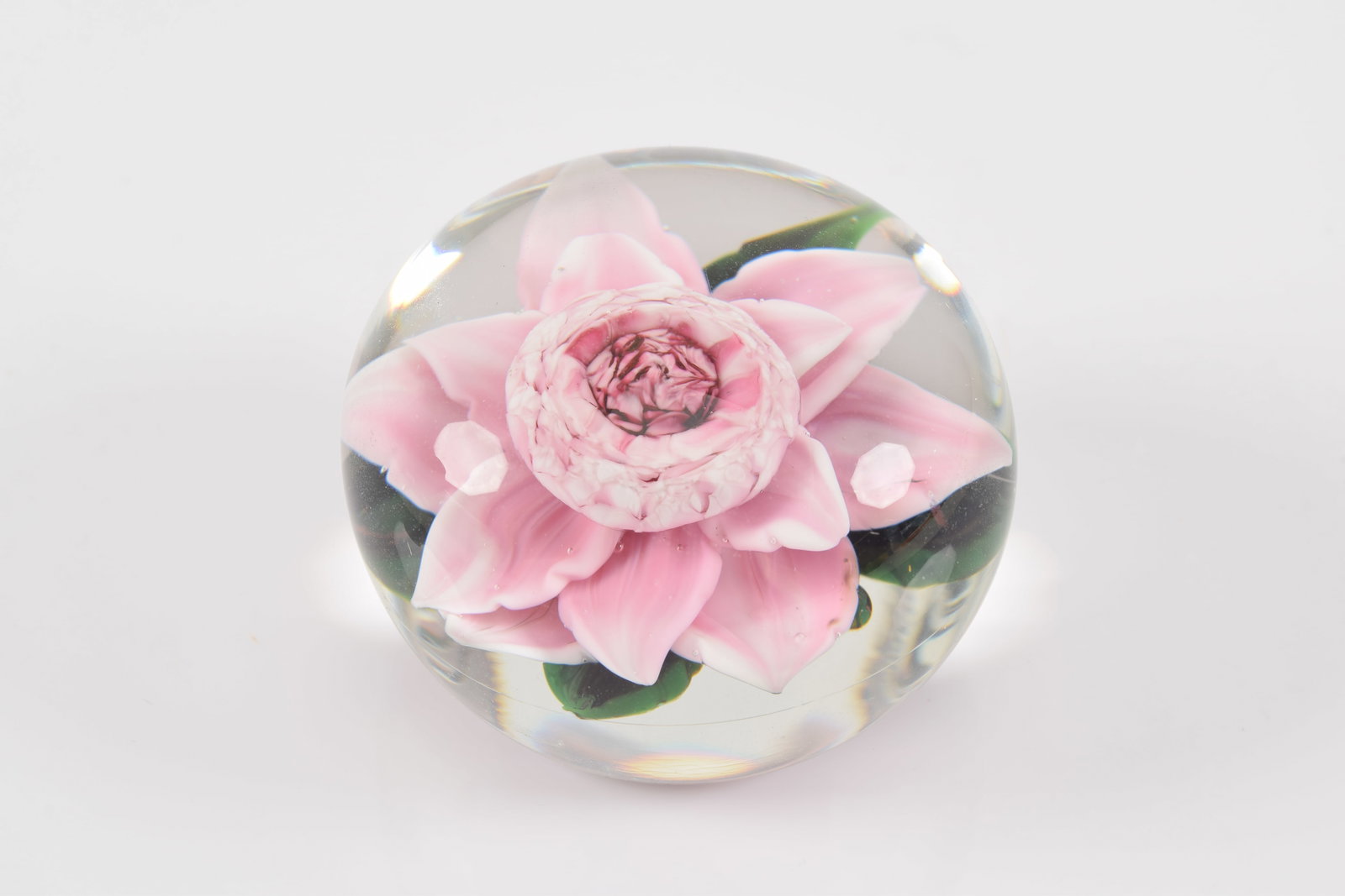 Rick Ayotte pink flower glass paperweight. Signed and numbered M-36 91. 2in diameter.: Rick Ayotte pink flower glass paperweight. Signed and numbered M-36 91. 2in diameter.