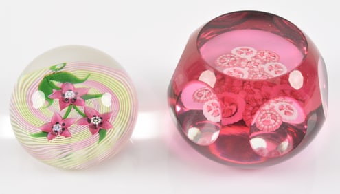 2 signed glass paperweights. Both signed "J" in small cane. Red paperweight: 2.75in diameter.