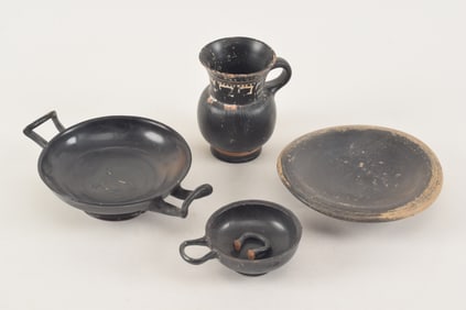 4 pieces of Bucchero black ware. 3rd century B.C. To include: 2 kylix, a plate, and a handled cup.