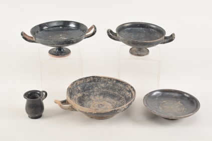 Lot of 5 ancient pottery items. Bucchero ware. Including 3 kylix bowls. Largest missing handle.