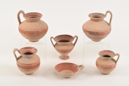 Lot of 6 ancient and ancient style pottery pieces with red-orange banded decoration. Largest: 6.25in