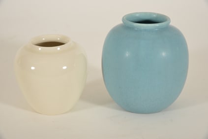 2 Rookwood art pottery small vases with incised marks. White vase, dated 1948, # 1321E and a mottled