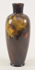 Rookwood pottery hand painted vase, ca. 1899. Decoration of yellow flowers on a dark orange/red