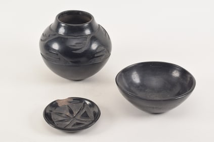 3 Southwestern blackware pottery pieces. Larger carved pot signed Faustina. Carved dish signed Pita