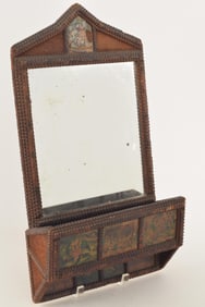 Late 19th century tramp art wall mirror with container. Carved wooden trim with panels of