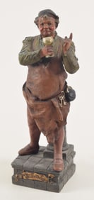 Oscar Gladenbeck polychrome ceramic figure holding chalice. Titled "Alter Wein" on base. Signed on
