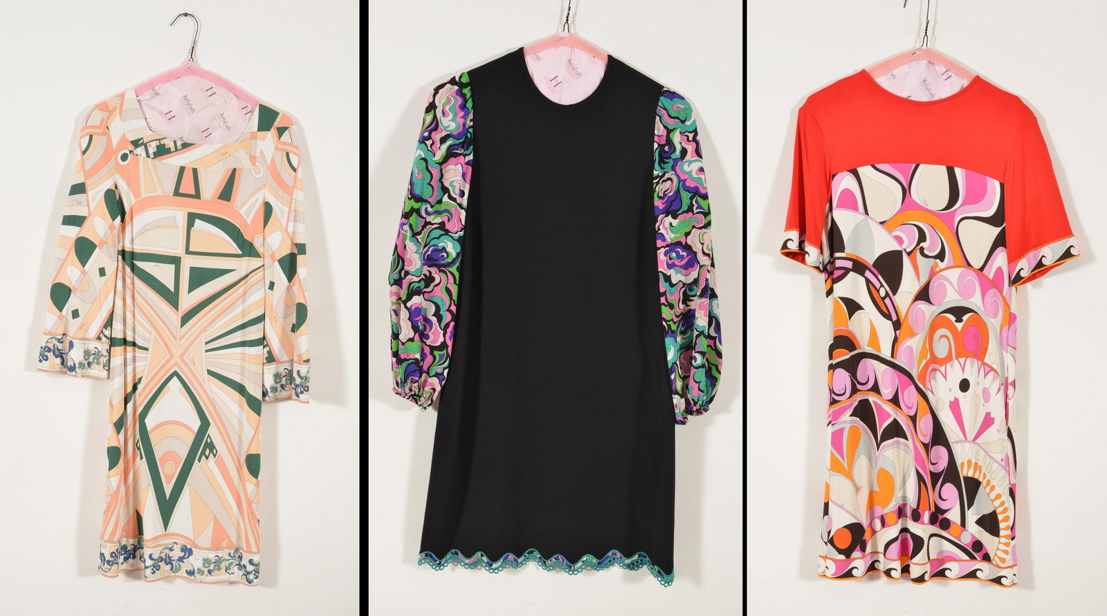 Lot of 3. Emilio Pucci vintage dresses. Circa 1990's. All with original labels. (1) Long sleeved: Lot of 3. Emilio Pucci vintage dresses. Circa 1990's. All with original labels. (1) Long sleeved black dress with floral print bishop sleeves. Silk sleeves, body of dress is Viscose/Rayon content. Siz