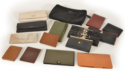 Large collection of wallets, clutches and check covers including Fendi, Prada and Coach.