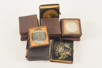 Large lot of daguerreotypes and ambrotypes, mid 19th century. To include: young mother with baby