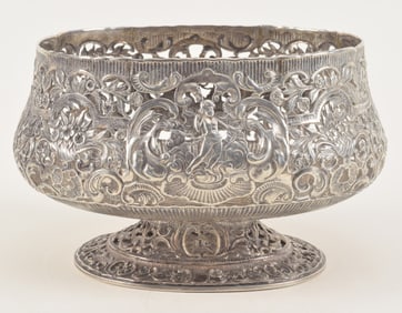 Large early Continental silver pierced decorated footed centerpiece. Figural and floral decoration.