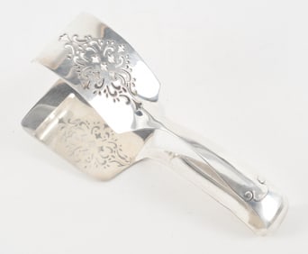 Tiffany & Co. makers sterling silver tongs with pierced decoration. 7.5in long. 5.6 ozt.