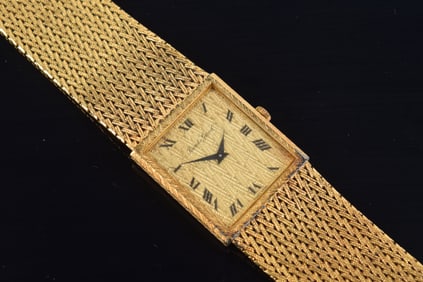 Bueche Girod 18K gold men's wristwatch. Herringbone pattern mesh band. Clasp marked Swiss 750 and