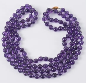 14K gold amethyst bead opera length necklace. Clasp marked 14K and maker's mark. Necklace length: