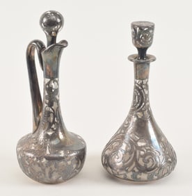 2 Sterling silver overlay bottles, hallmarked. Including a handles ewer and a decanter. Heights