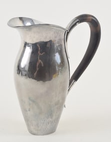 Sterling silver hand hammered ewer or small pitcher. Wood handle. Marked on base. Cross maker's