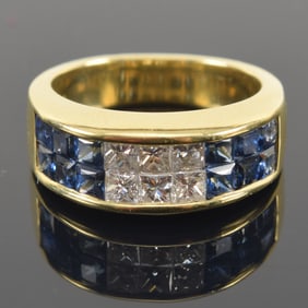 18K gold sapphire and diamond ring. 2 rows of square cut diamonds and sapphires. About 2.2mm square