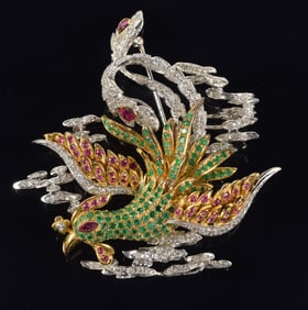 Large 18K gold diamond, ruby and emerald encrusted phoenix brooch. Yellow and white gold setting