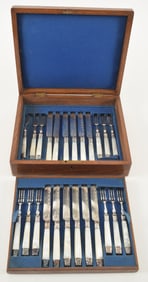 Antique cased silver plated fruit set with mother of pearl handles. 12 forks and knives. Knife