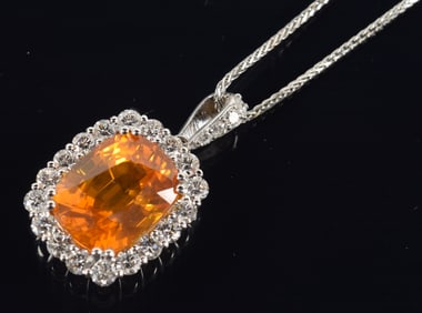 18K white gold natural orange sapphire and diamond mounted pendant necklace. Sapphire approx. 16.55