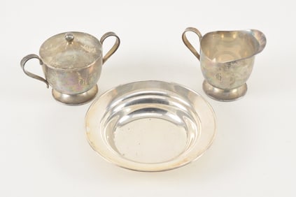 2 sterling silver repousse dishes with floral decoration. 8.9 ozt. Large dish 9.5in diameter.