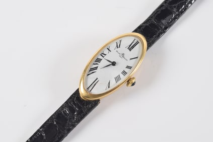 Baume & Mercier 18K gold Swiss wristwatch. Gold case and leather band. "382997" and "38261" with